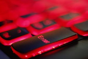 a close up of a red and black keyboard